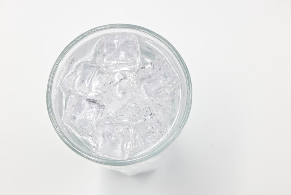 Close up of a nugget ice machine dispensing ice