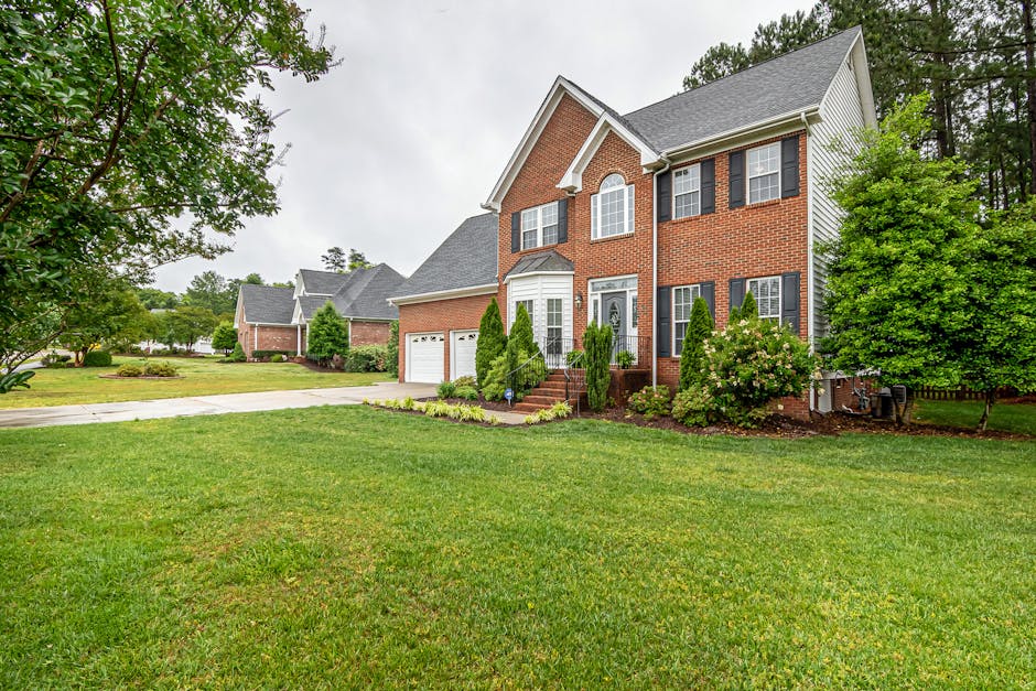 Wilmington coastal home with beautiful green lawn and live oaks