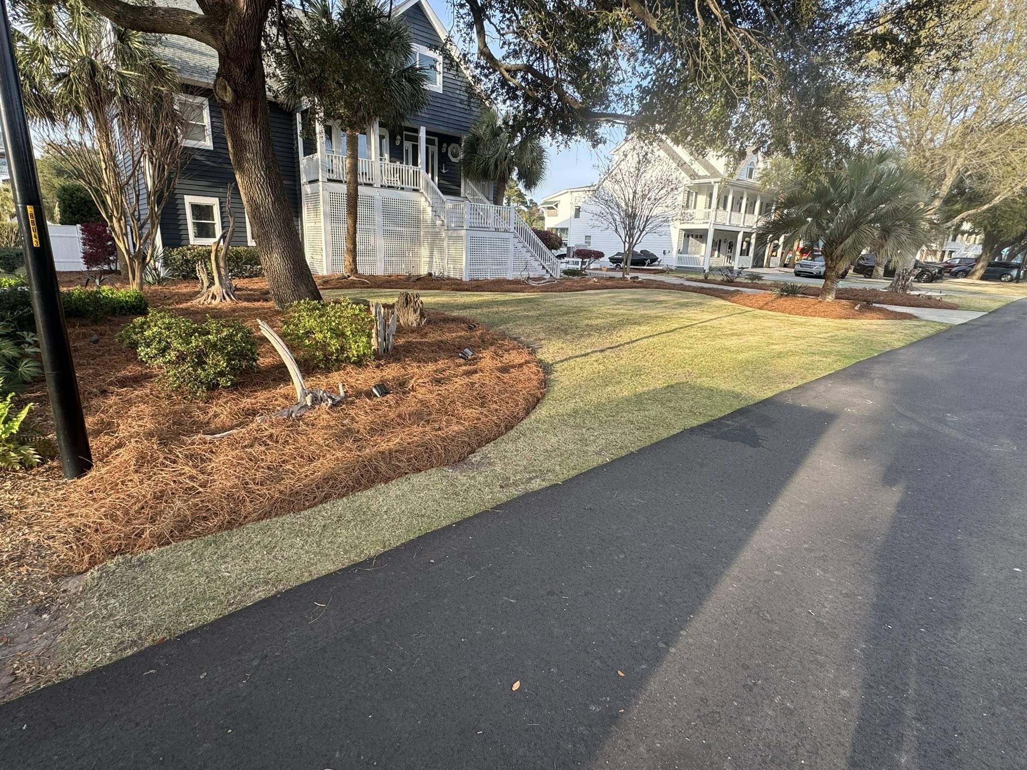 Recent Ace Lawn Care Landscaping Project featuring pine straw